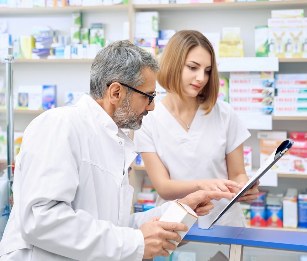 two-pharmacist-checking-product-in-folder.jpg two-pharmacist-checking-product-in-folder.jpg