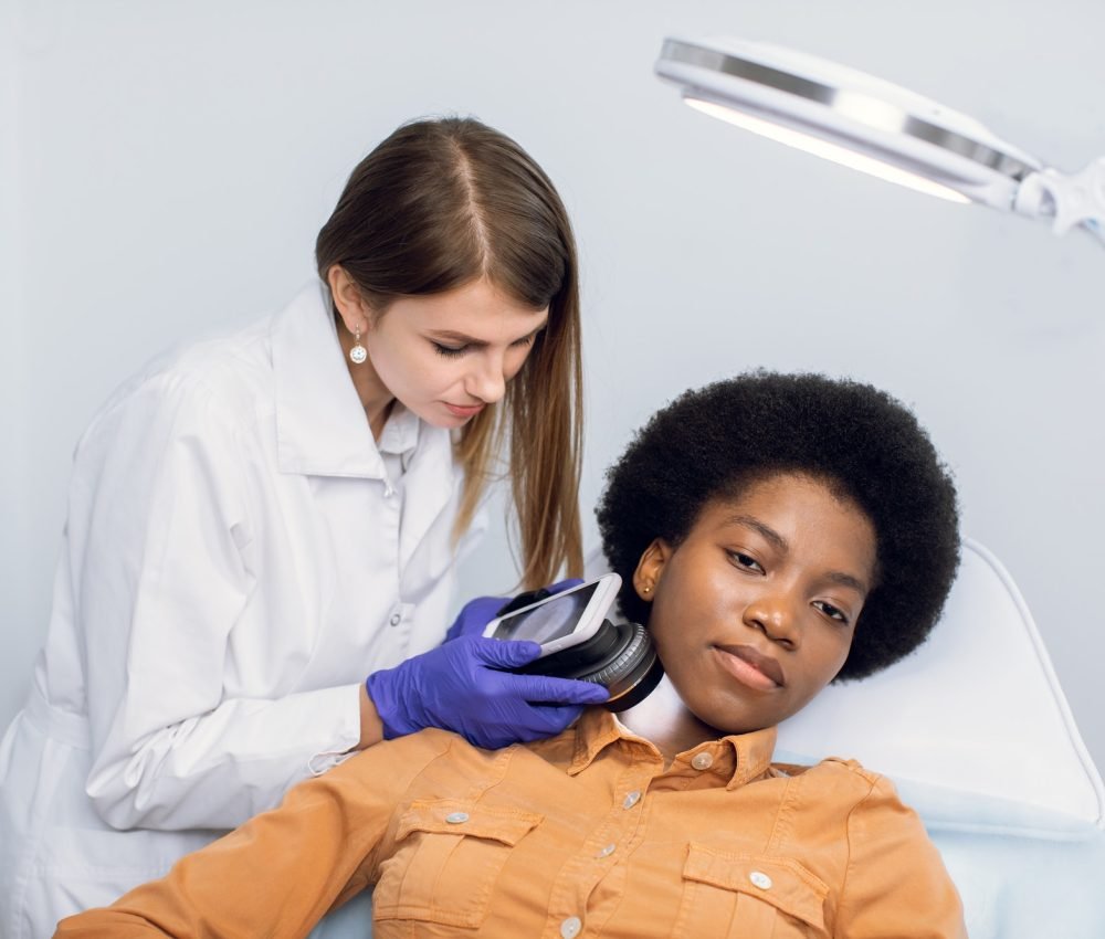young-african-american-woman-client-lying-on-the-couch-in-modern-dermatology-clinic-having-face.jpg young-african-american-woman-client-lying-on-the-couch-in-modern-dermatology-clinic-having-face.jpg